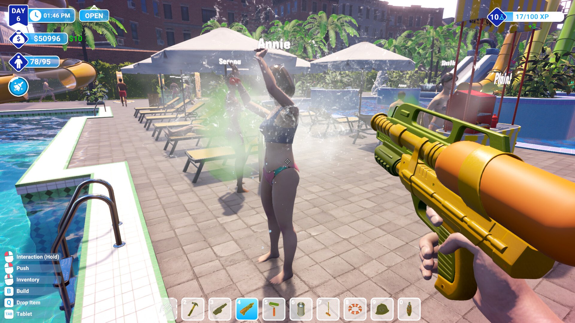 A player sprays a guest with the water gun